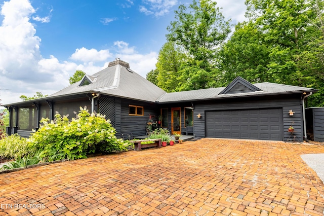 1139 Reagan Valley Rd, Tellico Plains, TN 37385 - view of front of home with a garage, a chimney, and decorative driveway