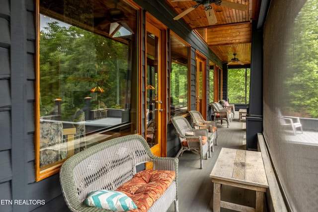 1139 Reagan Valley Rd, Tellico Plains, TN 37385 - sunroom with a ceiling fan, french doors, wood finished floors, and beamed ceiling