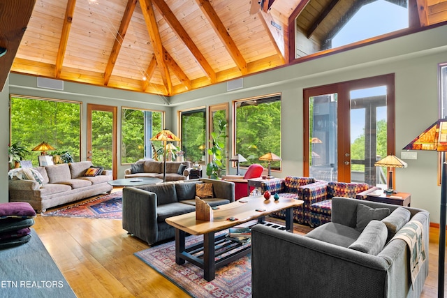 1139 Reagan Valley Rd, Tellico Plains, TN 37385 - living area featuring a wood ceiling with exposed beams, wood finished floors, high vaulted ceiling, and french doors