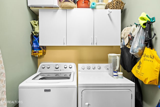 1139 Reagan Valley Rd, Tellico Plains, TN 37385 - laundry area featuring independent washer and dryer and cabinet space