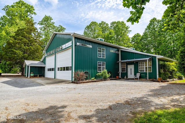 1139 Reagan Valley Rd, Tellico Plains, TN 37385 - view of front of property with an outdoor structure, driveway, and a garage