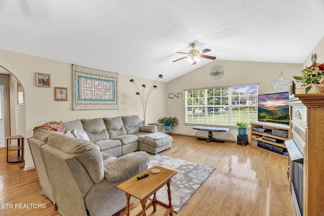 1647 Sams Dr, Dandridge, TN 37725 - living room with arched walkways, ceiling fan, lofted ceiling, and light wood-type flooring