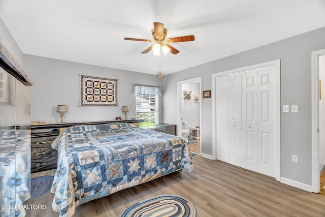 1647 Sams Dr, Dandridge, TN 37725 - bedroom featuring wood finished floors, a closet, baseboards, and ceiling fan