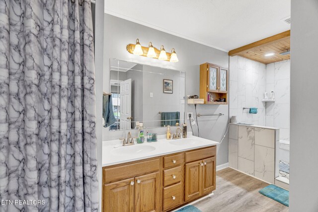 1647 Sams Dr, Dandridge, TN 37725 - full bath featuring wood finished floors, double vanity, a marble finish shower, and ornamental molding