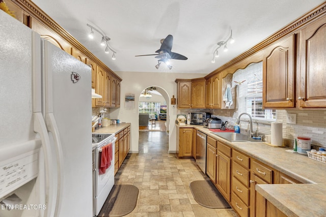 1647 Sams Dr, Dandridge, TN 37725 - kitchen featuring white appliances, a sink, ceiling fan, arched walkways, and tasteful backsplash