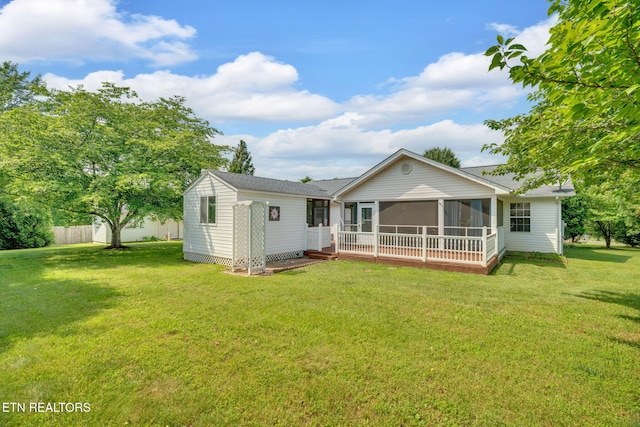 1647 Sams Dr, Dandridge, TN 37725 - rear view of house with a sunroom and a yard