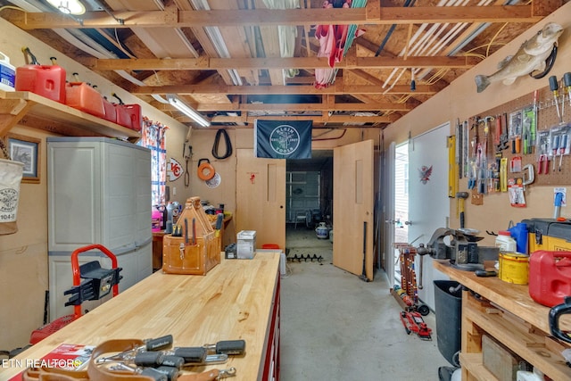 1647 Sams Dr, Dandridge, TN 37725 - misc room with concrete floors and a workshop area