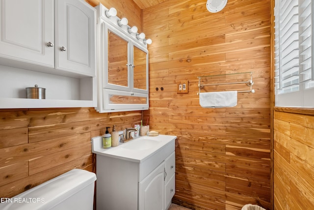 601 S Gallaher View Rd, Knoxville, TN 37919 - bathroom with wooden walls, vanity, and toilet