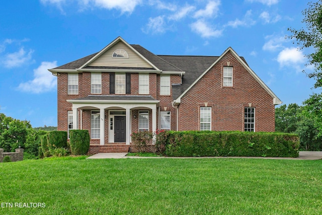 1010 Creek Brook Ln, Seymour, TN 37865 - view of front of property with brick siding, a front yard, and covered porch