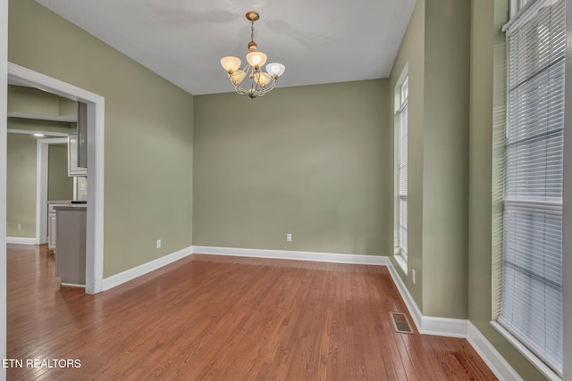 1010 Creek Brook Ln, Seymour, TN 37865 - empty room featuring a chandelier and wood finished floors