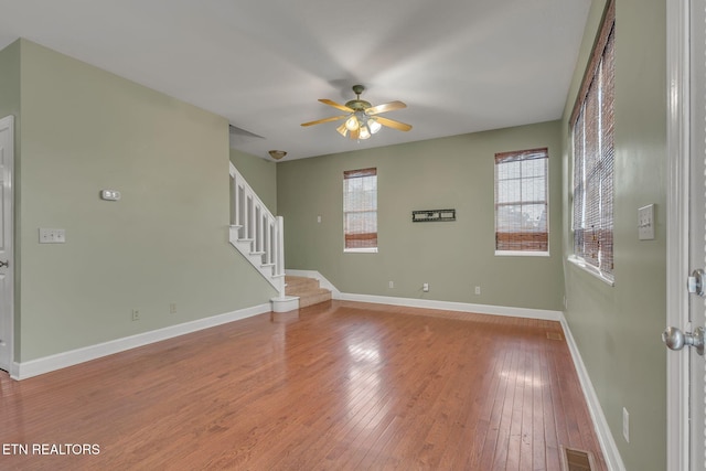 1010 Creek Brook Ln, Seymour, TN 37865 - empty room featuring ceiling fan, light wood finished floors, and stairway