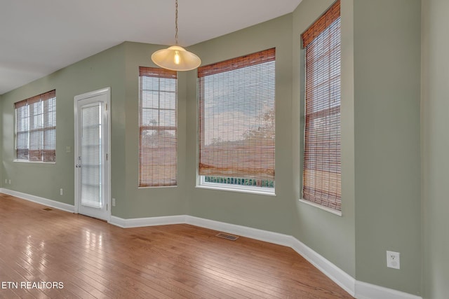 1010 Creek Brook Ln, Seymour, TN 37865 - unfurnished dining area featuring hardwood / wood-style flooring and baseboards