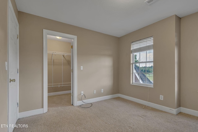 1010 Creek Brook Ln, Seymour, TN 37865 - unfurnished bedroom featuring a walk in closet, carpet floors, and a closet