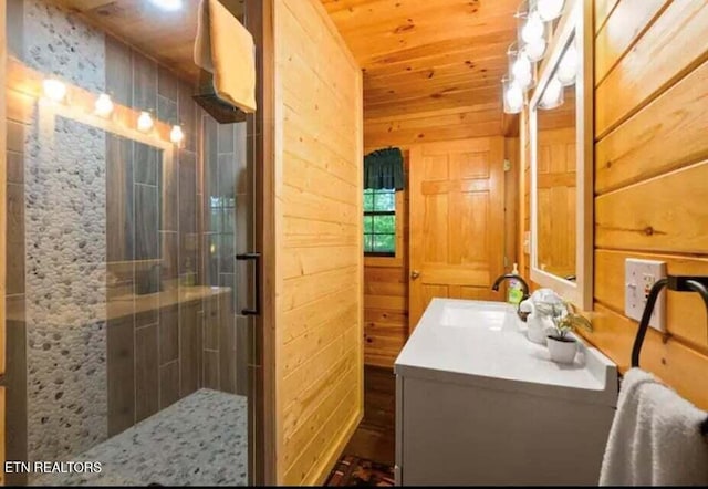 1930 Regans Ridge Way, Sevierville, TN 37876 - full bathroom featuring a shower stall, vanity, wooden walls, and wooden ceiling
