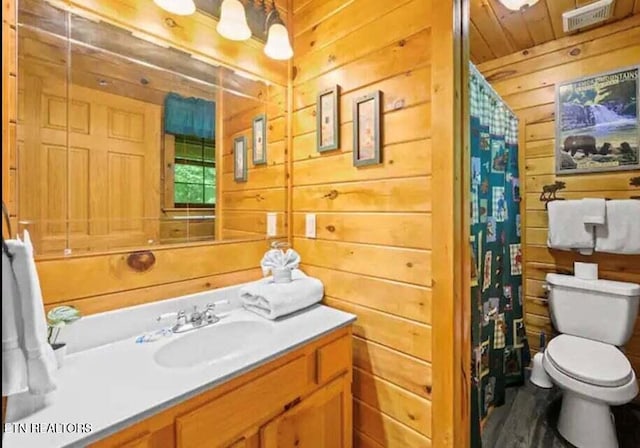 1930 Regans Ridge Way, Sevierville, TN 37876 - full bath with wood walls, toilet, vanity, a shower with shower curtain, and wooden ceiling