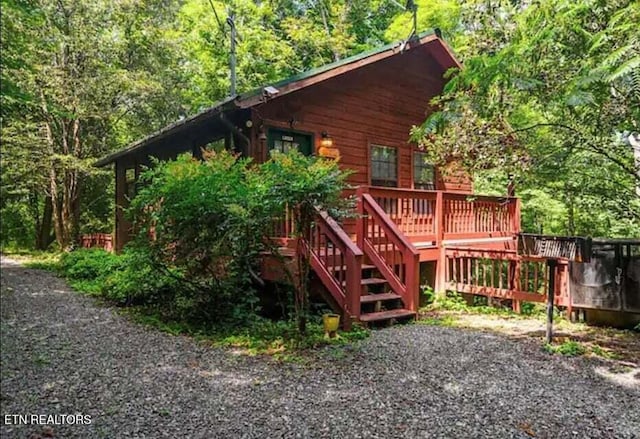 1930 Regans Ridge Way, Sevierville, TN 37876 - rear view of property featuring a wooden deck and a wooded view