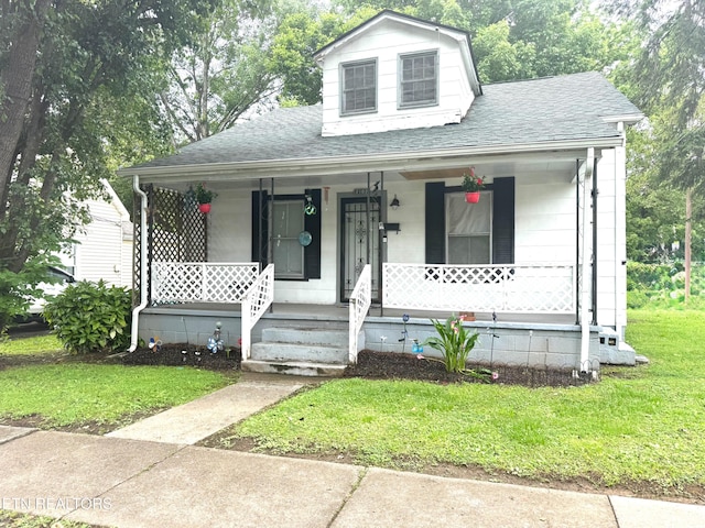 2102 Harvey St, Knoxville, TN 37917 - view of front of property with covered porch, roof with shingles, and a front yard