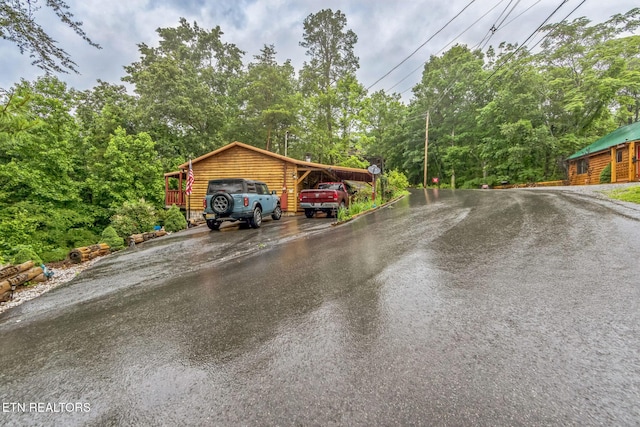 1737 Walker Trl, Sevierville, TN 37876 - view of car parking featuring driveway and view of wooded area