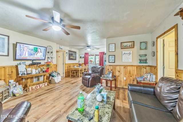 1737 Walker Trl, Sevierville, TN 37876 - living area featuring a wainscoted wall, ceiling fan, wood finished floors, and wood walls