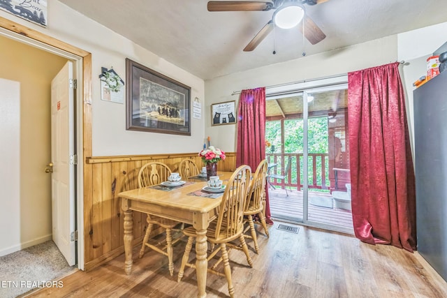 1737 Walker Trl, Sevierville, TN 37876 - dining area featuring wood finished floors, ceiling fan, a wainscoted wall, and wooden walls