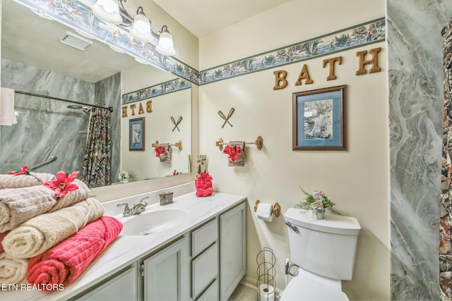 1737 Walker Trl, Sevierville, TN 37876 - full bathroom featuring vanity, toilet, and curtained shower