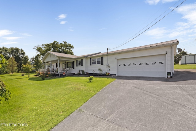 8318 Clapps Chapel Rd, Corryton, TN 37721 - ranch-style house featuring covered porch, a front lawn, driveway, and metal roof