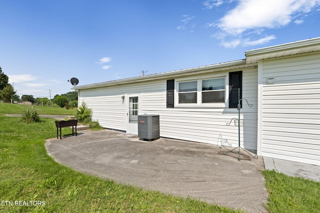 8318 Clapps Chapel Rd, Corryton, TN 37721 - back of property featuring central AC, a patio, and a lawn