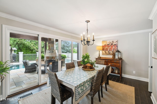 12368 N Fox Den Dr, Knoxville, TN 37934 - dining space featuring a chandelier, crown molding, baseboards, and dark wood-style flooring