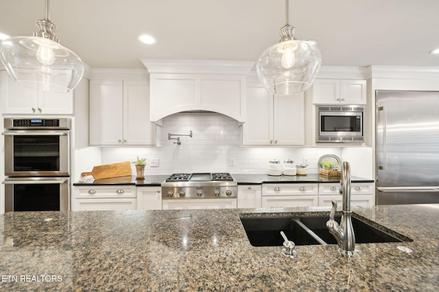 12368 N Fox Den Dr, Knoxville, TN 37934 - kitchen featuring built in appliances, white cabinets, a sink, tasteful backsplash, and dark stone counters