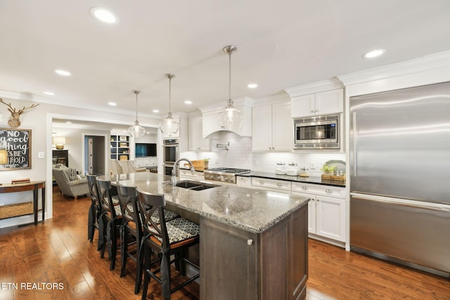 12368 N Fox Den Dr, Knoxville, TN 37934 - kitchen featuring built in appliances, a sink, backsplash, dark wood finished floors, and white cabinets