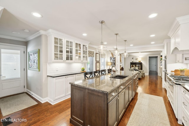 12368 N Fox Den Dr, Knoxville, TN 37934 - kitchen with a sink, glass insert cabinets, dark wood finished floors, white cabinets, and recessed lighting