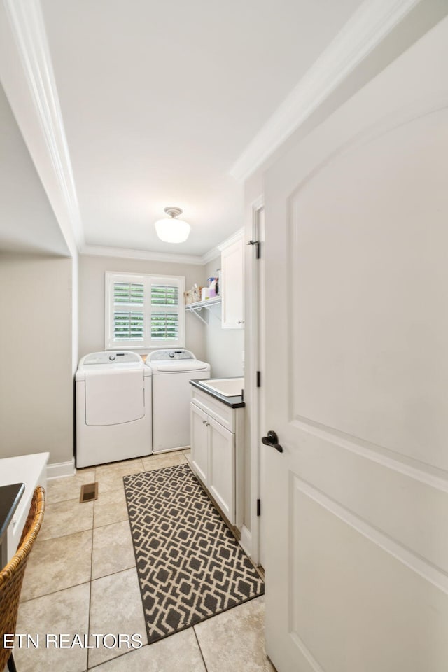 12368 N Fox Den Dr, Knoxville, TN 37934 - laundry room featuring independent washer and dryer, cabinet space, crown molding, and light tile patterned floors