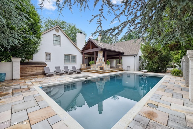 12368 N Fox Den Dr, Knoxville, TN 37934 - rear view of house with a patio area and a chimney