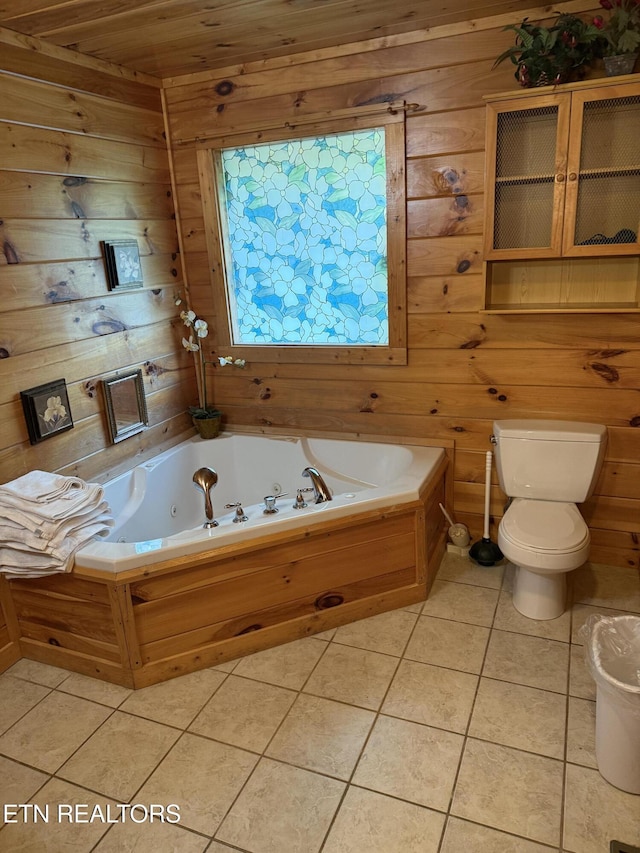 2020 Regans Ridge Way, Sevierville, TN 37876 - bathroom with wooden walls, tile patterned floors, and a tub with jets