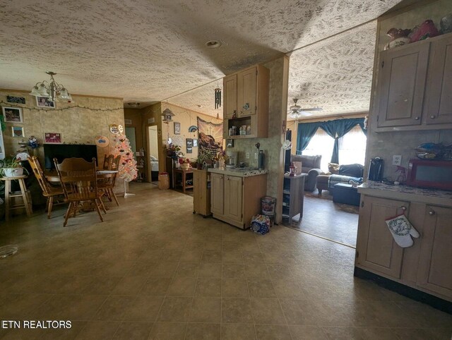 626 S 22nd St, Middlesboro, KY 40965 - kitchen featuring a textured ceiling, ceiling fan, and light countertops