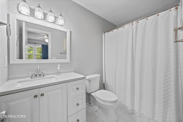613 Vose Rd Unit B, Alcoa, TN 37701 - bathroom featuring toilet, vanity, a textured ceiling, tile patterned floors, and a ceiling fan