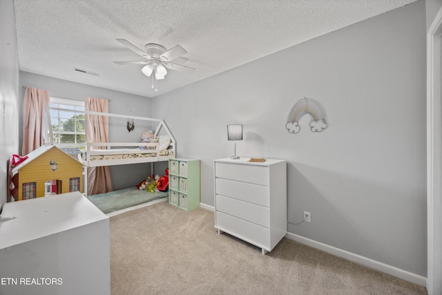 613 Vose Rd Unit B, Alcoa, TN 37701 - carpeted bedroom featuring a textured ceiling, baseboards, and a ceiling fan