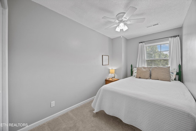 613 Vose Rd Unit B, Alcoa, TN 37701 - bedroom featuring baseboards, a textured ceiling, carpet floors, and a ceiling fan