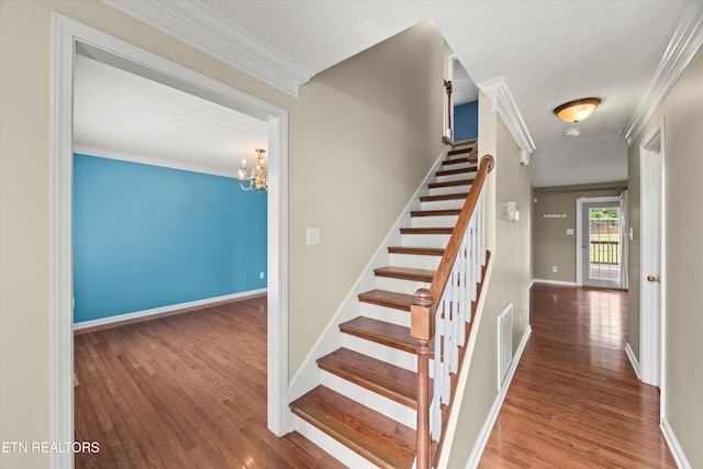 7127 Fieldstone Farms Ln, Knoxville, TN 37921 - stairs with ornamental molding, hardwood / wood-style flooring, a chandelier, and baseboards