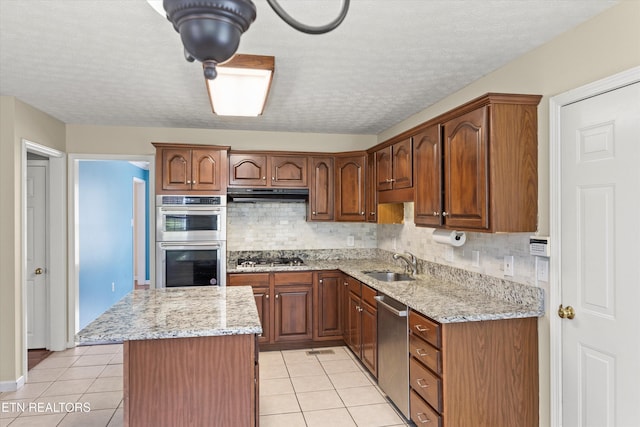 7127 Fieldstone Farms Ln, Knoxville, TN 37921 - kitchen with appliances with stainless steel finishes, a sink, light tile patterned floors, decorative backsplash, and a textured ceiling