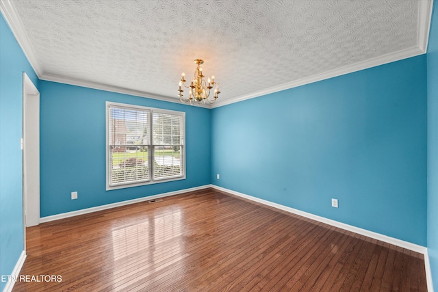 7127 Fieldstone Farms Ln, Knoxville, TN 37921 - empty room with a chandelier, a textured ceiling, wood-type flooring, crown molding, and baseboards