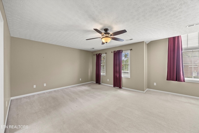 7127 Fieldstone Farms Ln, Knoxville, TN 37921 - empty room featuring a ceiling fan, light carpet, a textured ceiling, and baseboards