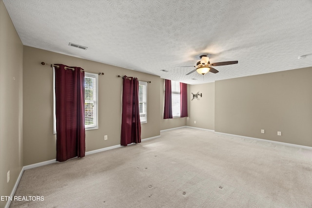 7127 Fieldstone Farms Ln, Knoxville, TN 37921 - empty room featuring a ceiling fan, a textured ceiling, light colored carpet, and baseboards