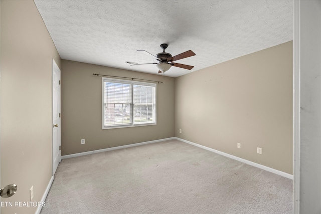 7127 Fieldstone Farms Ln, Knoxville, TN 37921 - unfurnished room featuring a ceiling fan, light colored carpet, a textured ceiling, and baseboards