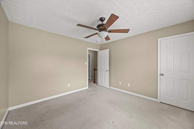 7127 Fieldstone Farms Ln, Knoxville, TN 37921 - unfurnished bedroom with baseboards, light carpet, a textured ceiling, and ceiling fan
