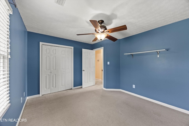 7127 Fieldstone Farms Ln, Knoxville, TN 37921 - unfurnished bedroom with a closet, carpet flooring, baseboards, a ceiling fan, and a textured ceiling