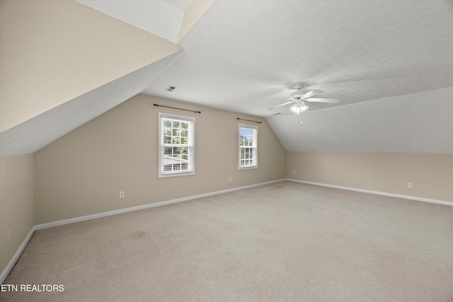 7127 Fieldstone Farms Ln, Knoxville, TN 37921 - bonus room featuring lofted ceiling, light carpet, a ceiling fan, baseboards, and a textured ceiling