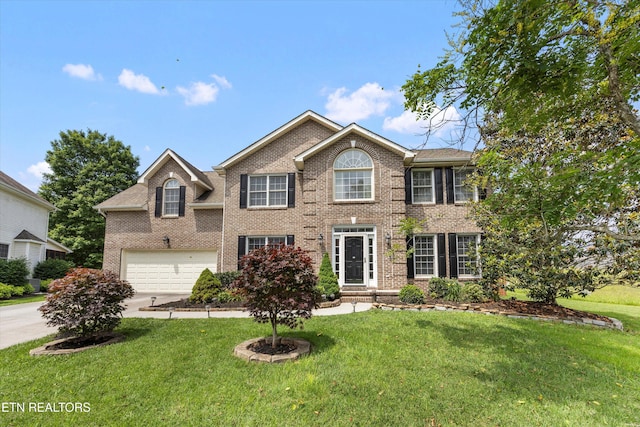 7127 Fieldstone Farms Ln, Knoxville, TN 37921 - view of front of home featuring concrete driveway, an attached garage, brick siding, and a front lawn
