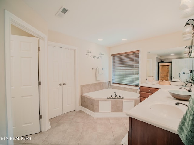 1201 Bentley Park Ln, Knoxville, TN 37922 - bathroom featuring a garden tub, double vanity, tile patterned flooring, and recessed lighting