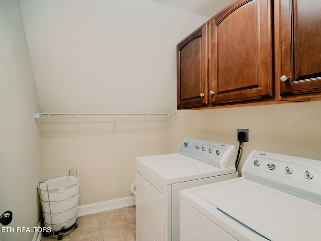 1201 Bentley Park Ln, Knoxville, TN 37922 - laundry area featuring cabinet space, washer and clothes dryer, baseboards, and light tile patterned flooring